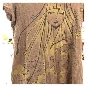 Brown and Yellow shirt with a girl on it.